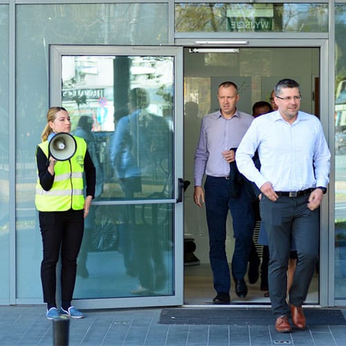 Fire warden evacuating a building